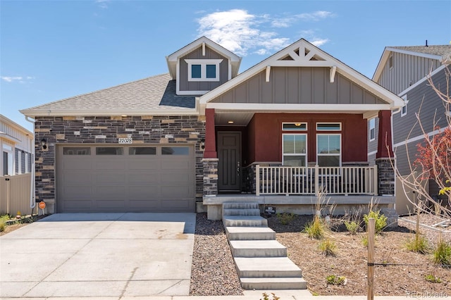 craftsman house with a porch and a garage