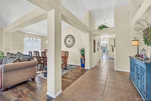 16048 Butterwort Cir, Parker, CO 80134 - foyer entrance with tile patterned flooring, baseboards, a towering ceiling, and an inviting chandelier