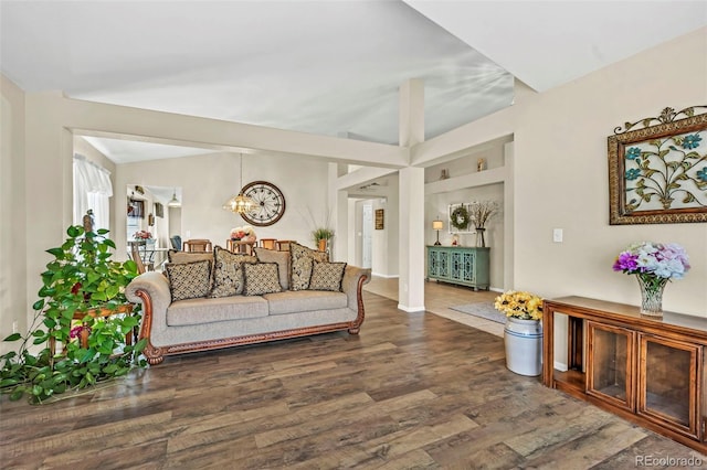 16048 Butterwort Cir, Parker, CO 80134 - living room featuring vaulted ceiling, wood finished floors, and a chandelier