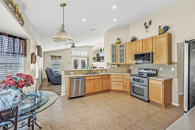 16048 Butterwort Cir, Parker, CO 80134 - kitchen featuring decorative backsplash, stainless steel appliances, light countertops, and a sink