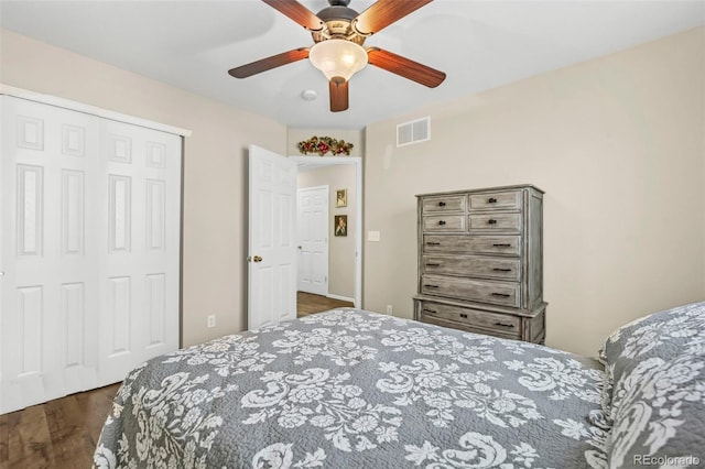 16048 Butterwort Cir, Parker, CO 80134 - bedroom with a closet, visible vents, dark wood-style floors, and ceiling fan