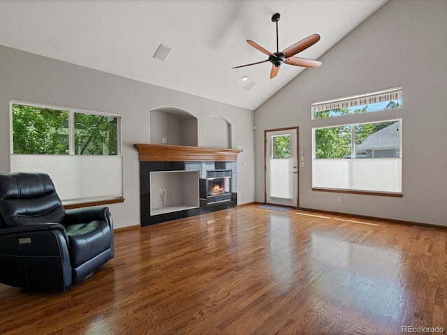 6900 W Grant Ranch Blvd Unit 49, Littleton, CO 80123 - living area featuring a fireplace, wood finished floors, ceiling fan, and high vaulted ceiling