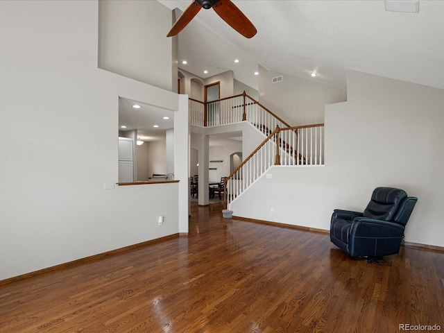 6900 W Grant Ranch Blvd Unit 49, Littleton, CO 80123 - unfurnished living room featuring stairway, ceiling fan, wood finished floors, recessed lighting, and high vaulted ceiling
