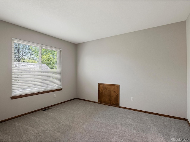 6900 W Grant Ranch Blvd Unit 49, Littleton, CO 80123 - carpeted spare room with baseboards