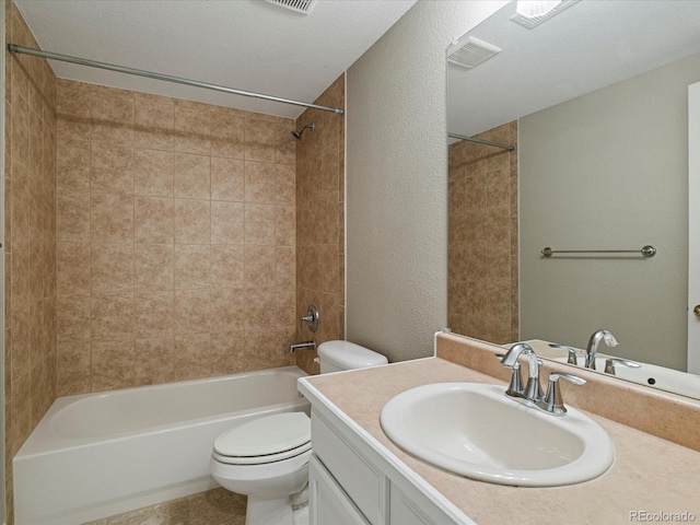 6900 W Grant Ranch Blvd Unit 49, Littleton, CO 80123 - full bath featuring toilet, vanity, washtub / shower combination, tile patterned floors, and a textured wall