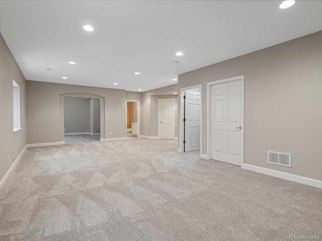 6900 W Grant Ranch Blvd Unit 49, Littleton, CO 80123 - spare room featuring arched walkways, light colored carpet, baseboards, and recessed lighting