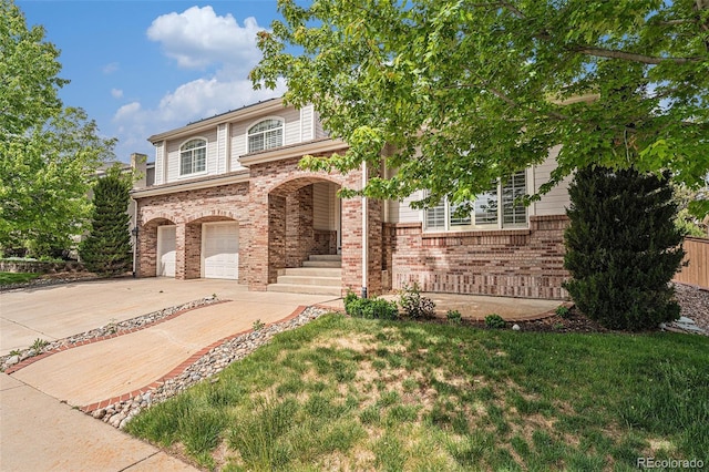 10155 Charissglen Ln, Littleton, CO 80126 - view of front of property with driveway, brick siding, and an attached garage