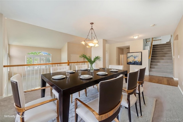 10155 Charissglen Ln, Littleton, CO 80126 - dining area featuring carpet floors, baseboards, a chandelier, and stairs