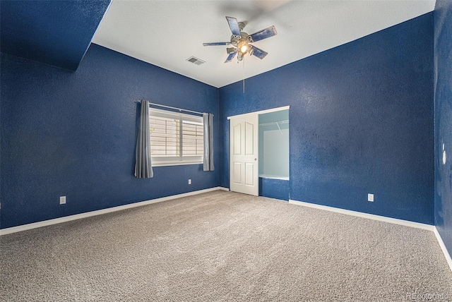 10155 Charissglen Ln, Littleton, CO 80126 - carpeted spare room featuring ceiling fan, a textured wall, lofted ceiling, and baseboards