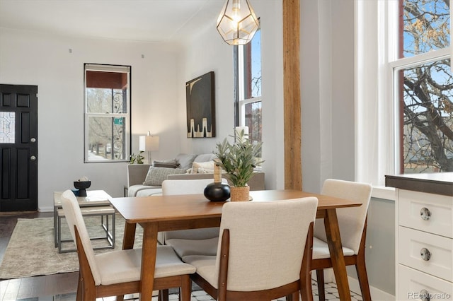 dining area with dark hardwood / wood-style floors