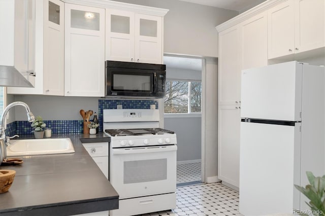 kitchen featuring white cabinetry, white appliances, and sink