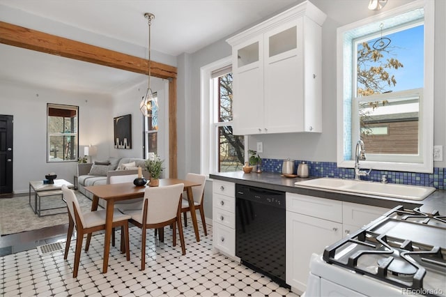 kitchen with white cabinetry, dishwasher, and gas range gas stove