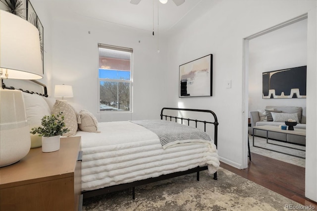 bedroom featuring dark wood-type flooring and ceiling fan