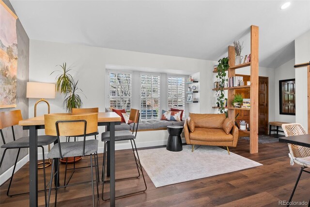 dining room with baseboards, vaulted ceiling, recessed lighting, and dark wood-type flooring
