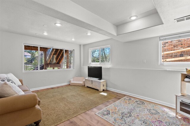 sitting room with recessed lighting, baseboards, visible vents, and wood finished floors