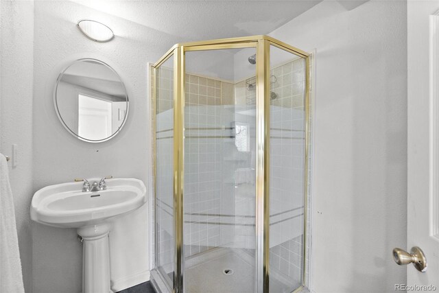 full bath featuring a shower stall
