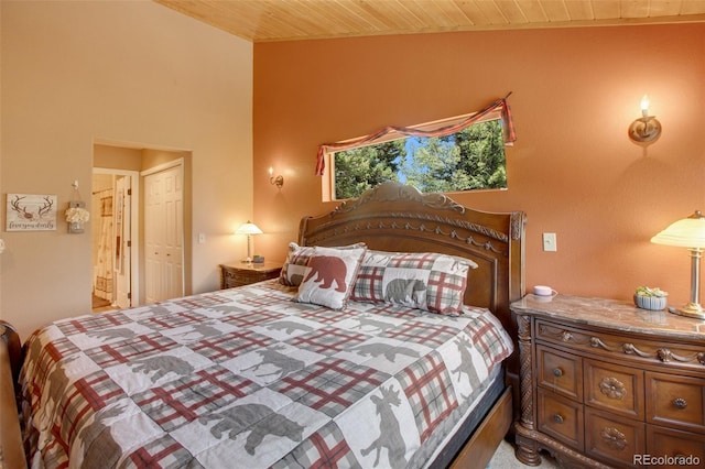 bedroom featuring wood ceiling and lofted ceiling