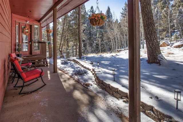 view of snow covered patio