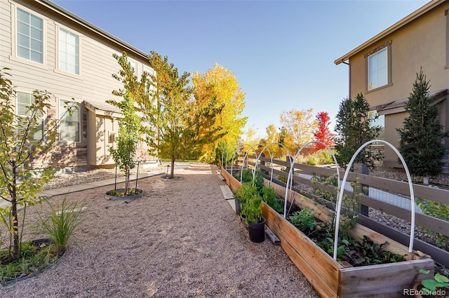 view of yard featuring a garden and fence