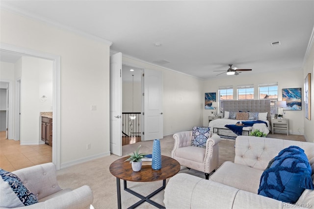 living area featuring light carpet, ornamental molding, visible vents, and baseboards