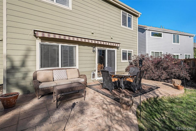 10359 Tracewood Dr, Highlands Ranch, CO 80130 - rear view of property featuring a patio, outdoor lounge area, and fence