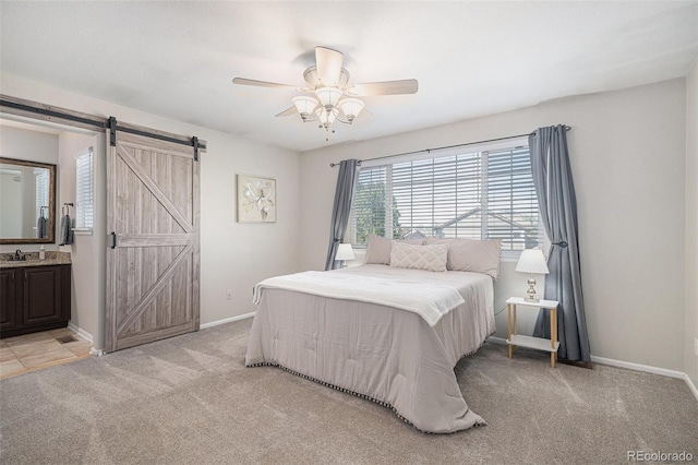10359 Tracewood Dr, Highlands Ranch, CO 80130 - bedroom featuring a barn door, light carpet, and baseboards