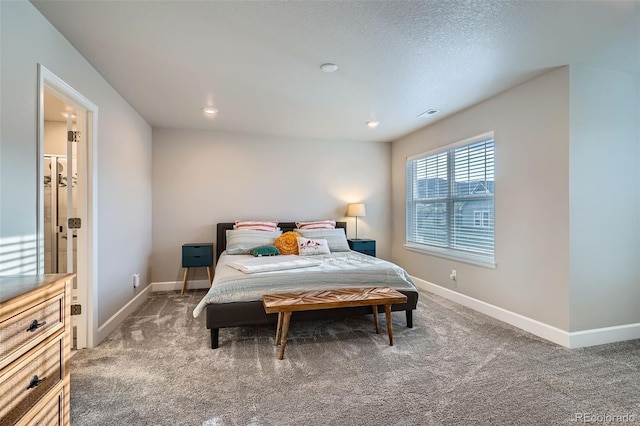 carpeted bedroom featuring baseboards and recessed lighting