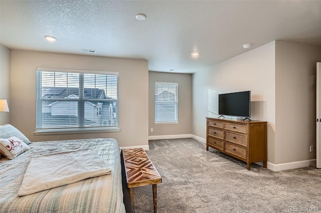 bedroom with carpet floors, baseboards, recessed lighting, and a textured ceiling