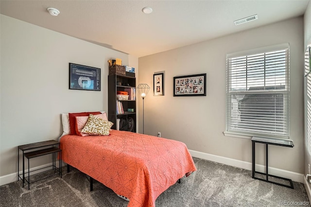 carpeted bedroom with baseboards