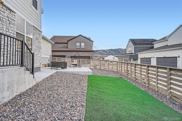 view of yard with a patio area and a mountain view