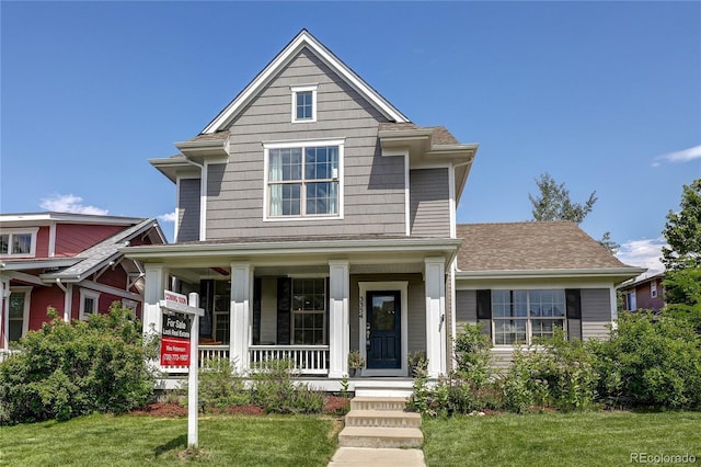3354 Wabash St, Denver, CO 80238 - view of front of house with a porch and a front lawn