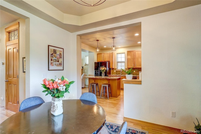 3354 Wabash St, Denver, CO 80238 - dining area with light wood-style flooring and recessed lighting