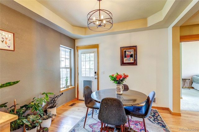 3354 Wabash St, Denver, CO 80238 - dining area featuring light wood-type flooring and a chandelier