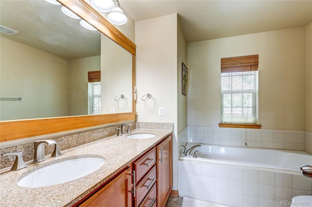 3354 Wabash St, Denver, CO 80238 - bathroom featuring double vanity and a bath