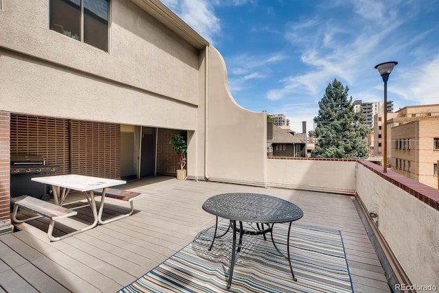 830 N Sherman St Unit 105, Denver, CO 80203 - wooden deck featuring a grill