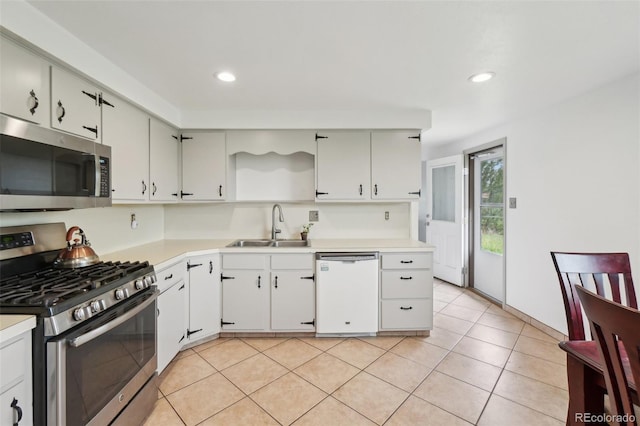 12734 Anhawa Ave, Longmont, CO 80503 - kitchen with stainless steel appliances, light countertops, recessed lighting, light tile patterned flooring, and open shelves