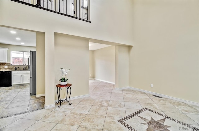 interior space with sink and a high ceiling