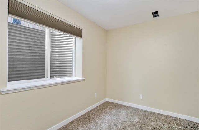 unfurnished room with carpet flooring