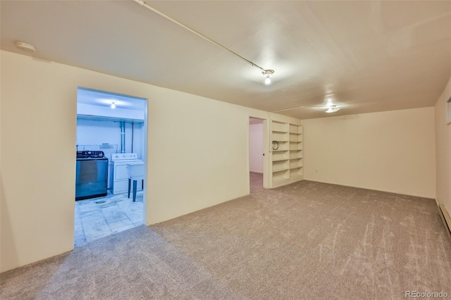 empty room with carpet flooring and washer / clothes dryer