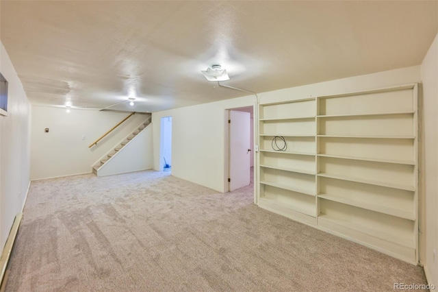 basement featuring light colored carpet