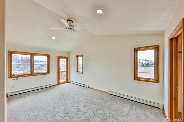 unfurnished room with ceiling fan, lofted ceiling, and baseboard heating