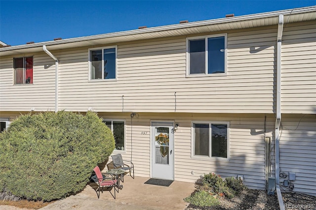 rear view of house with a patio