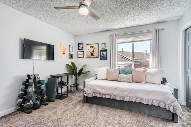 bedroom with carpet flooring, a textured ceiling, and ceiling fan