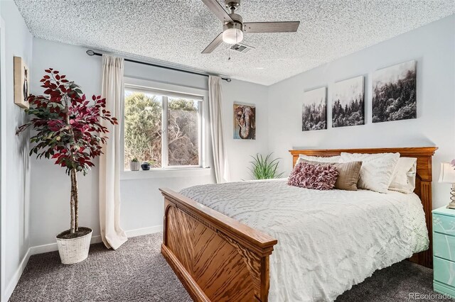 bedroom featuring ceiling fan, carpet floors, and a textured ceiling