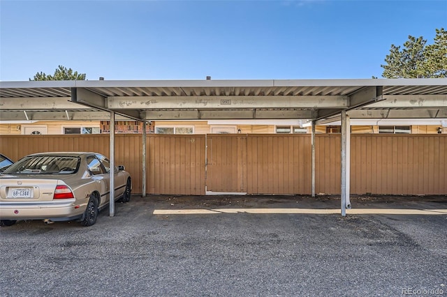 view of vehicle parking with a carport