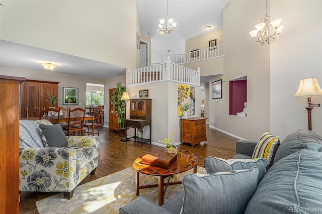 6836 Poppy Ct, Arvada, CO 80007 - living room with a chandelier, a towering ceiling, and wood finished floors