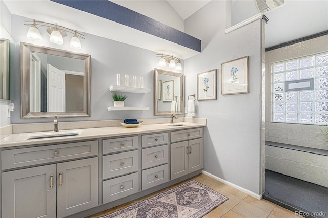 6836 Poppy Ct, Arvada, CO 80007 - bathroom with double vanity, tile patterned floors, and lofted ceiling