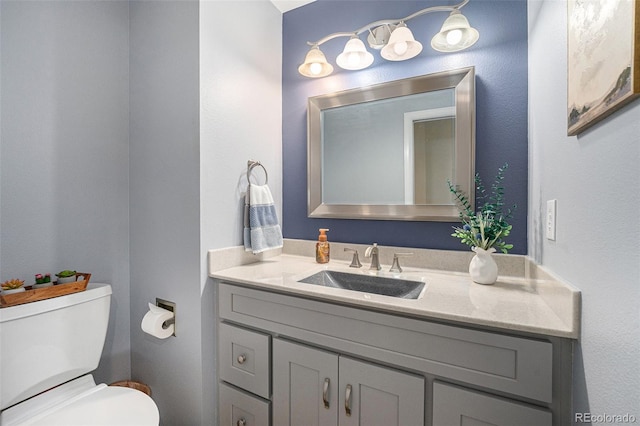 6836 Poppy Ct, Arvada, CO 80007 - half bathroom featuring vanity and toilet