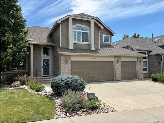 6836 Poppy Ct, Arvada, CO 80007 - view of front facade featuring brick siding, driveway, a shingled roof, a front lawn, and an attached garage