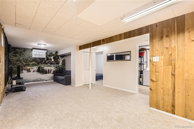 13123 Spica Dr, Lone Tree, CO 80124 - below grade area featuring carpet flooring, wood walls, and baseboards